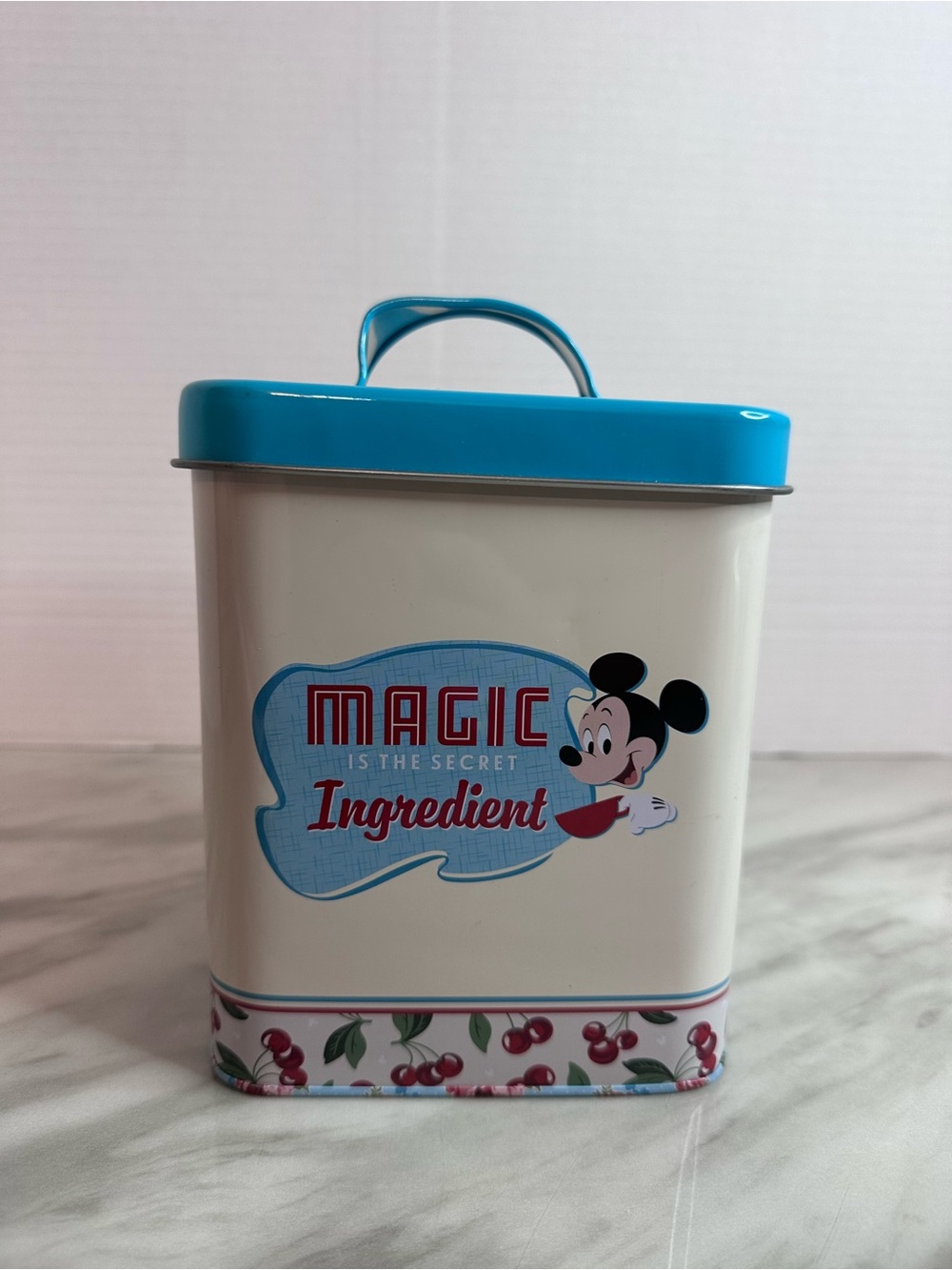 Disney White Tin with Teal Lid and Cherry Accent